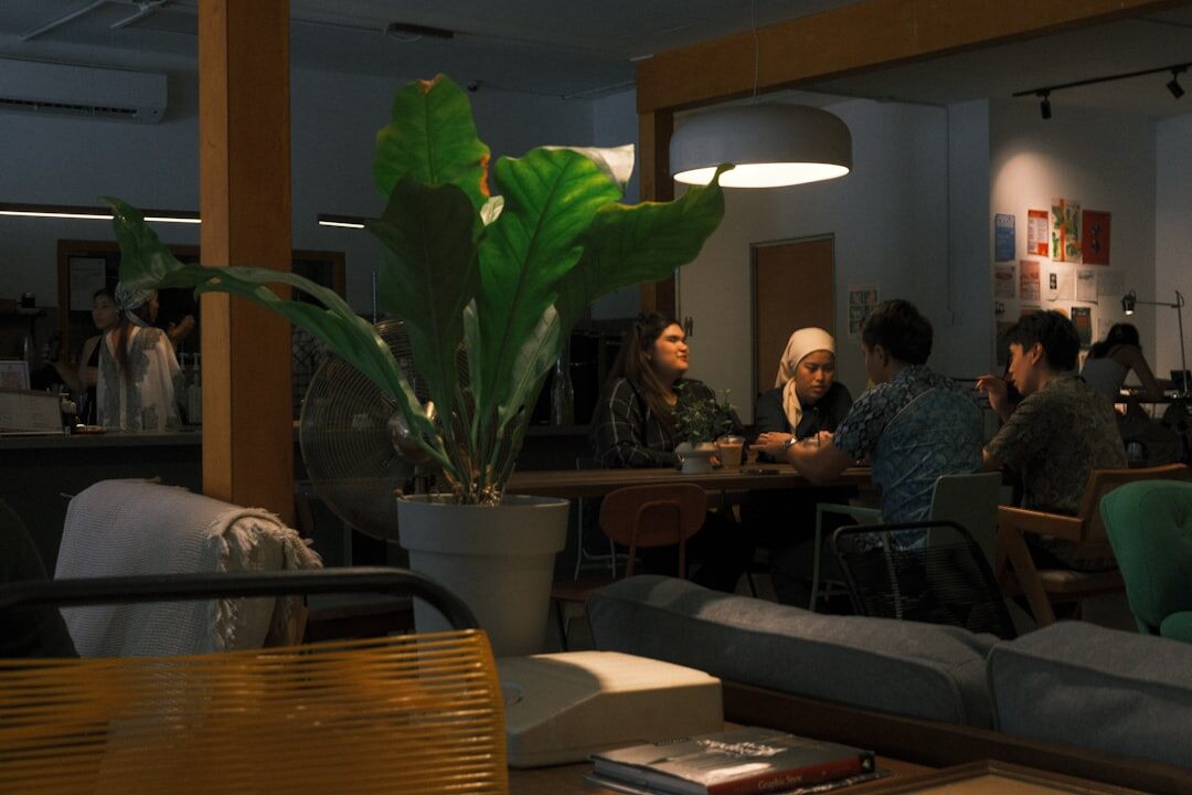 Group of older adults relaxing and chatting in a modern community lounge