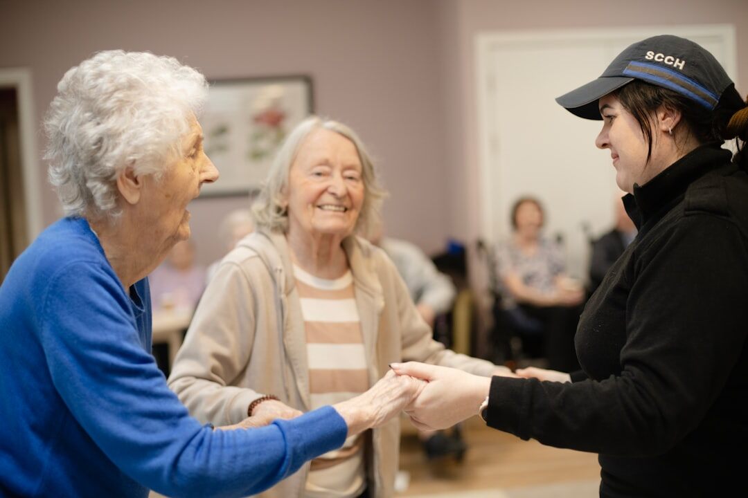 senior woman smiling with caregiver