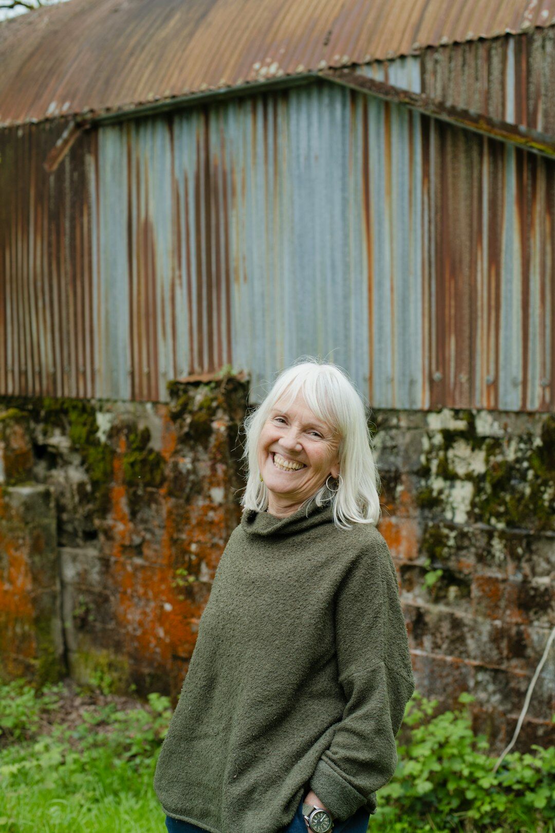 Studio portrait of a smiling older woman outdoors